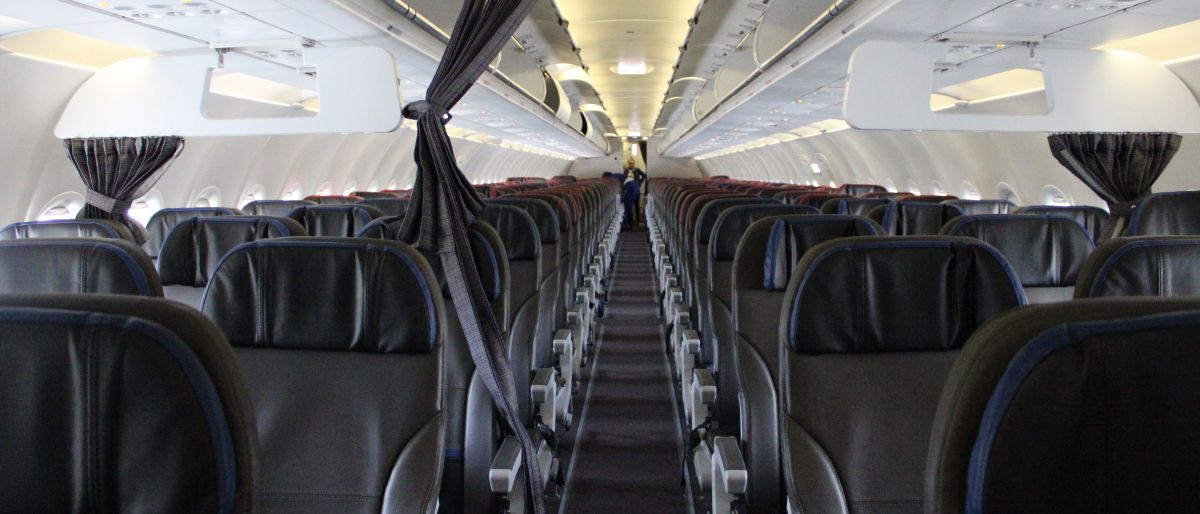 Cabin of a LATAM Airlines Airbus A320 seen from front to back